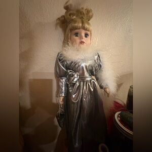 Elegant Silver Doll with Feather Trim